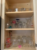 Contents of kitchen shelves drinking glasses