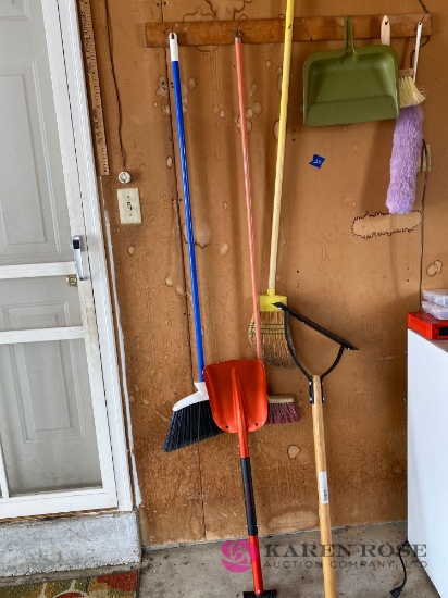 Assorted brooms and tools