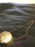 Chain and Locket the chain is 14kt and locket gold filled