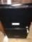 Black file cabinet with key