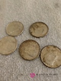 Five silver Kennedy half dollars