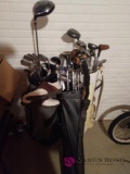 Three sets of golf clubs