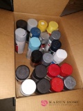 Cans of spray paint partially used