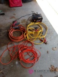 Battery charger, two sets of jumper cables, and extension cord