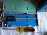 Caliper and miscellaneous tools (upstairs bedroom)