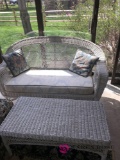 White wicker love seat and end table