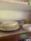 Plates and miscellaneous inside kitchen cabinet