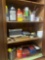 Contents of cabinet in garage insect killer paint brushes steel wall bolts and miscellaneous