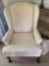 Cream colored wing back chair