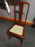 Small wicker bottom rocking chair