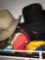 Top shelf of casual hats/cowboy hats