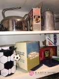 Assorted tea pots and vintage cracker tins