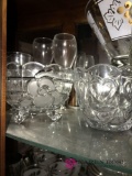 Top shelf of crystal glassware