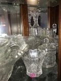 Shelf of crystal glassware and bowls/plates