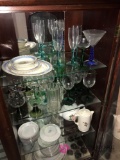 3- shelves in cabinet stem glasses/ partial dish set
