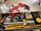 Contents of drawer including tools, tape measure, and more see pictures. In rec room