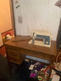 Sewing table with singer sewing machine