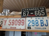 Lot of vintage license plates. Barn location