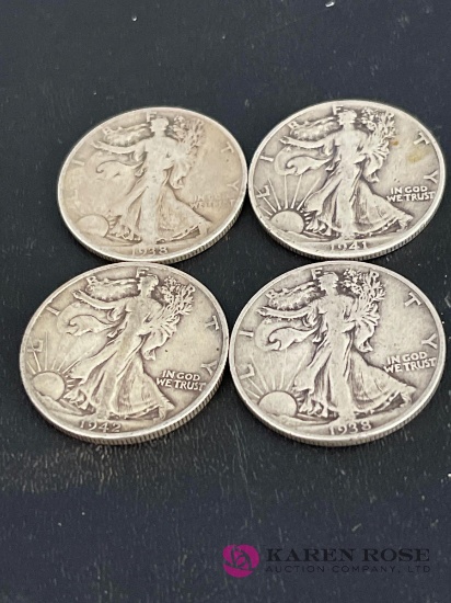 Lot of four standing liberty halves