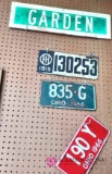 1915 porcelain license plate, 1964 and 1966 license plate and garden road signs