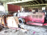 Two large vintage sprayers in barn