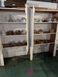 Six shelves of lamp parts and sheets