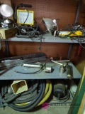 Contents of three shelves including Grease guns, lights, hoses and motor