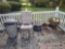 Flower pots lawn chair garden hose and waste basket