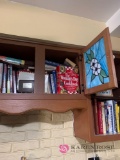 Two kitchen cabinets of cookbooks