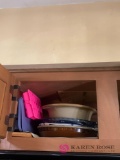 Baking dishes cabinet above the microwave