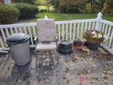 Flower pots lawn chair garden hose and waste basket