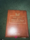 Book of golden replicas of United States stamps