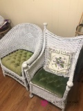 2- white wicker chairs