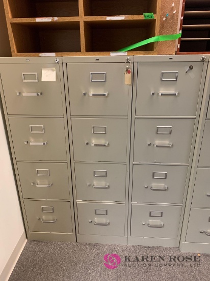 three 4 drawer file cabinets in/checkout area