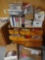 dresser with contents including a lot of dollhouse accessories and books. bs