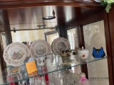 Shelf of assorted vintage glassware