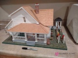 handcrafted lighted dollhouse. BS