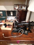 vintage Singer sewing machine with all accessories and cabinets and table. bs