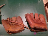 two vintage baseball mitts. BS