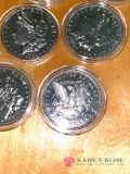 Lot of six reproduction barber head silver dollars