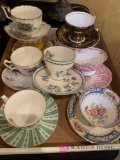 Nine assorted tea cups with saucers