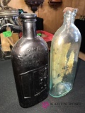 2- vintage advertising bottles