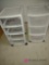 two rolling storage bins. master bedroom closet