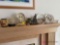 13 assorted decorator items on mantle
