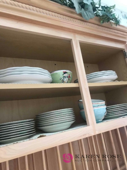 Dishes in kitchen cabinet Christmas dinnerware