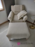 chair with ottoman pillow and blanket. master bedroom