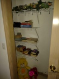 miscellaneous items in closet including stuffed animals and books