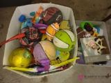lot of toys including basketballs, football, dolls, helmets and more