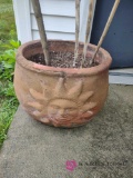 two flower pots approximately 16 in by 18 in