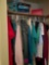 Contents of upstairs closet ladies clothes and board games in B4